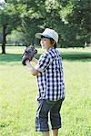 Boy Standing In a Park In Ready Position