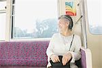 Senior woman traveling on a train