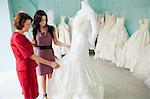 Mother and daughter looking at wedding dresses