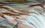 Close-up of Water Flowing over Rocks
