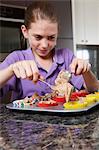 Girl making cakes in the kitchen