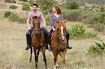 Couple riding horses