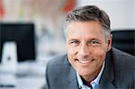 Man in suit smiling to camera