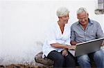 Senior couple with laptop