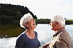 Senior couple having fun on lake