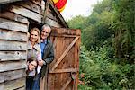Grandparents and girl hiding in shed