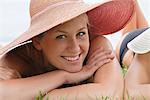 Young woman in straw hat woman smiling