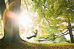 Girl on swing in sun