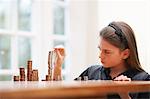 Girl Counting money at a table