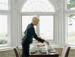 Woman setting up table