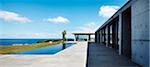 Modern one storey concrete house, patio and swimming pool. Architects: John Bornas of Workroom