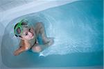 Boy in Bathtub Wearing Green Diving Mask