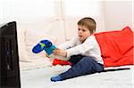 Boy with Cast on Leg Putting on Sock