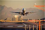 Airplane Taking Off at Sunset