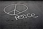 Peace sign and the word "peace" painted on the Berlin Wall, Berlin, Germany