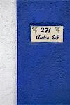 Address painted on stucco wall