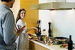 Couple preparing meal together