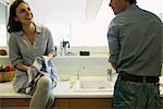 Couple washing dishes together