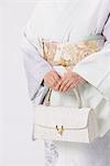 Mid-Section Japanese Woman Holding Purse