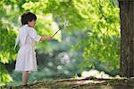 Angel Boy Standing Holding Magic Wand