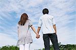 Couple in Park Holding Hands