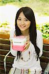 Young Woman Holding Lunch Box