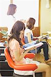 Young Woman Waiting for Haircut in Beauty Salon