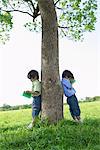 Twins Studying in Park