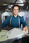 Man working in the laundrette