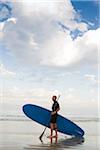 Paddleboarder am Strand