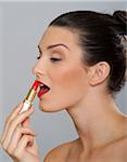 Woman Applying Lipstick