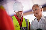 Captain of a ship talking to workers