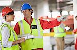 Architect talking to a builder