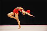 Japanese woman performing rhythmic gymnastics with ball