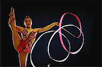 Woman acrobat performing with ribbon