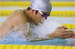 Athlete swimming breaststroke