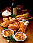 Quiche and savory puff pastry rolls