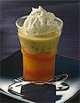 Citrus fruit salad with cardamom and vanilla custard and whipped cream