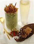 Herb and green apple mousse ,thinly sliced fried duck Magret and a glass of champagne