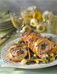 Rolled and stuffed roast veal with vegetables