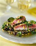 Red mullet fillets with pesto and pine nuts