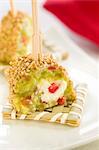 Avocado,cheese and sesame seed skewer