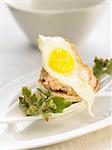 Foie gras and fried quail's egg canapé