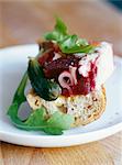 Chicken and beetroot terrine on a piece of bread