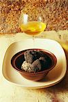Black truffle and glass of white wine