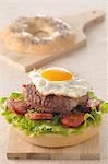 Hamburger,fried egg and Chorizo bagel burger