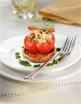 Tomato stuffed with rice and green and red pimento