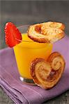 Glass of orange juice and Palmier biscuits