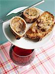 Marrow-bone on toast and a glass a red wine