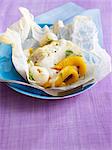 Cod with exotic fruit cooked in wax paper